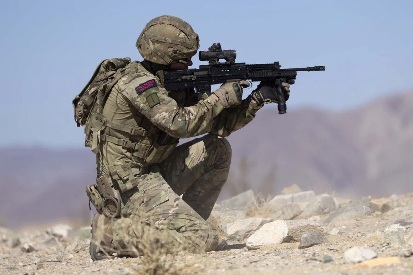 Desert operations with a Royal Marine at a hill crest